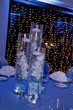 Pale Blue Orchid Centerpiece with Floating Candles & Custom Table Numbers
