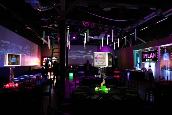 Neon Theme Bat Mitzvah Room with Lampshade Centerpieces and Blow Up Photos & Backdrop