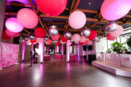 Bat Mitzvah at Second Floor NYC with Large Shades of Pink Balloons Ceiling Treatment, Custom Step and Repeat and Uplighting