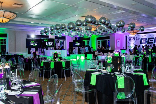 Neon Themed Bar Mitzvah with Silver Balloons over Dance Floor, LED Cinder Block Centerpieces, White Dance Floor & Custom Logo Sign Behind DJ at Tamarack Country Club