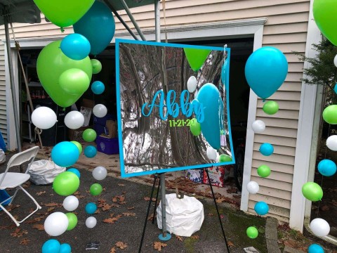 Balloon Bubble Strands as Accent Decor Near Sign in Board for Outdoor Bat Mitzvah