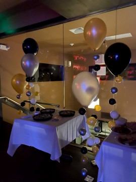 Balloon Bubble Stands as Accent Decor Near Food Table