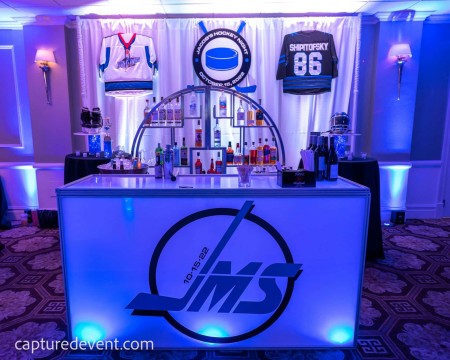 Hockey Themed Bar Decor with Jersey & Logo Display