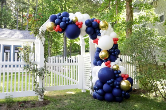 Organic Balloon Arch Over Outdoors Party Entryway