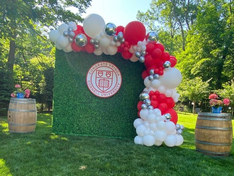 Greenery Wall with Red & White Balloon Garland and Custom sign for Graduation Party