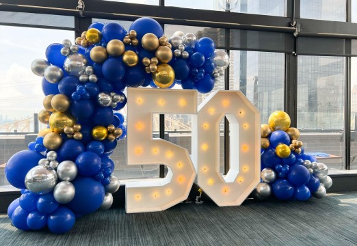 Blue, Silver & Gold Organic Balloon Garland over Marquee Numbers for 50th Birthday
