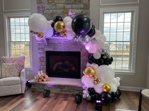 Black, White & Metallic Balloon Garland over Fireplace for Home Party
