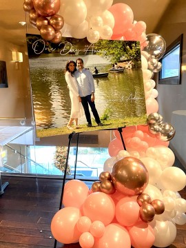 Organic Half Balloon Arch over Welcome Poster for Rehearsal Dinner Entrance Decor