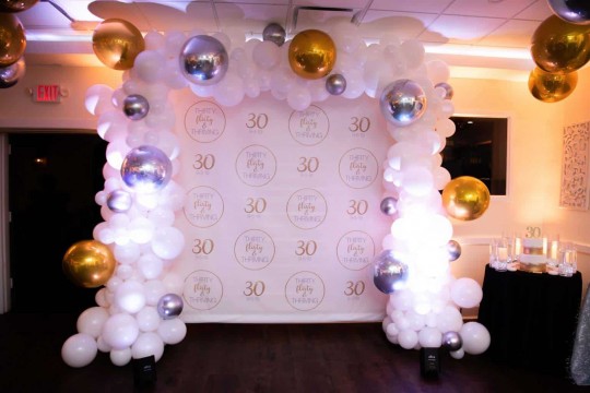 White, Gold & Silver Organic Balloon Arch around Custom Step & Repeat Backdrop