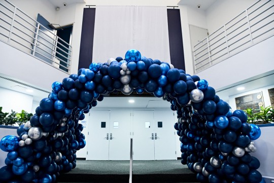 Beautiful Metallic Blue Balloon Tunnel around Stairs for Corporate Event