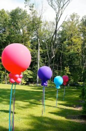 Large Balloons with Hanging Tassels at Outdoor First Birthday