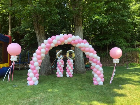 Pink & White Balloon Arch with Number Columns and Large Balloons with Tassels for Drive By Birthday