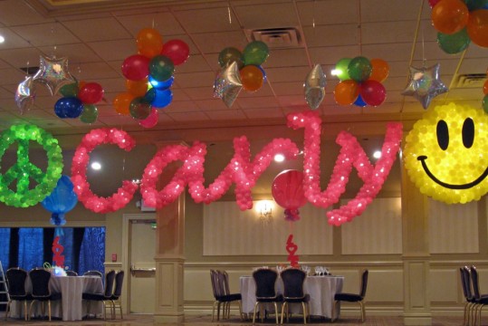 Pink Script Name in Balloons with Smiley Face and Peace Sign Balloon Sculpture