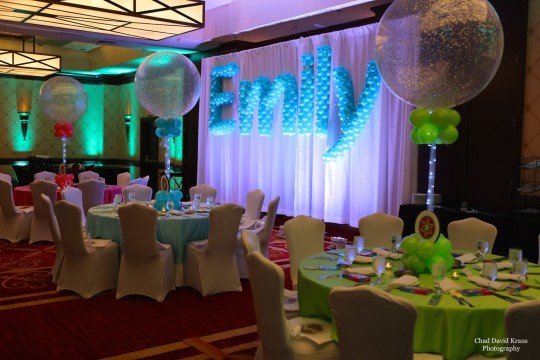 Turquoise Name in Balloons Sculpture on LED Curtain Backdrop