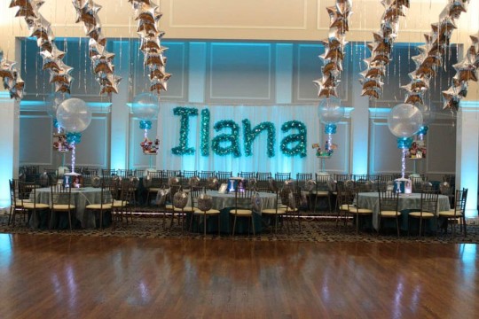 Teal Name in Balloons Sculpture on White Curtain Backdrop with LED Uplighting