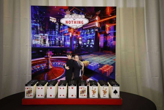 Casino Themed Seating Card Display with Vegas Background & Playing Card Place Cards