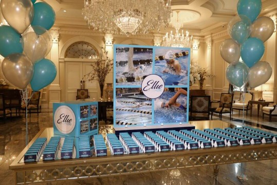 Swim Themed Seating Card Display with Photo Collage Background