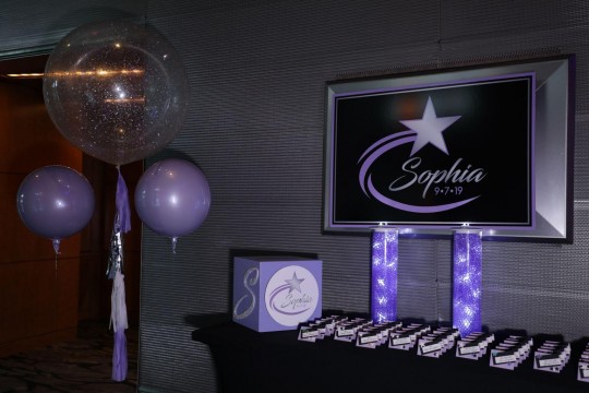 Galaxy Themed Seating Card Display with Custom Logo on LED Cylinders with Gems