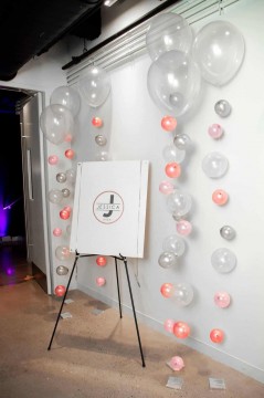 Custom Logo Sign in Board with Balloon Bubble Strands as Accent Decor Near Sign in Board