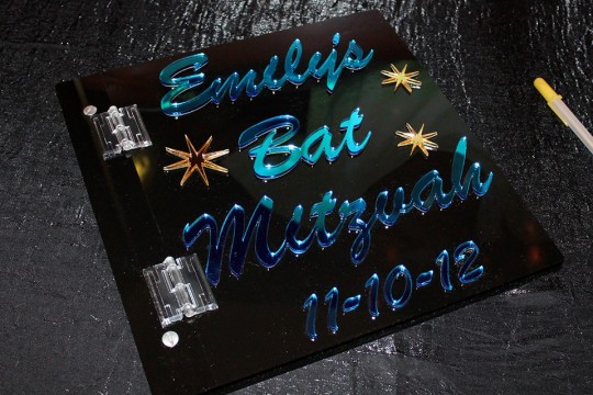 Black Lucite Sign in Book with Light Blue Mirror Lettering & Gold Stars