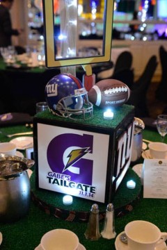 Football Themed Centerpiece with Sports Equipment and Turf Base