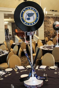 Hockey Puck Centerpiece with Team Logos & Criss Crossing Hockey Sticks