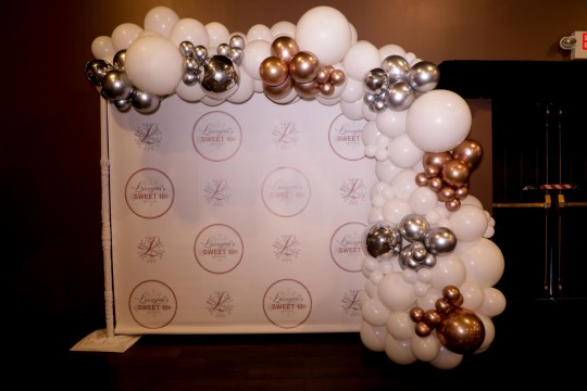 Beautiful Custom Step & Repeat with Organic Half Balloon Arch as Photo Op for Sweet Sixteen
