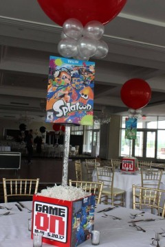Video Game Themed Centerpiece with Photo Cube Base & Blowup Game Cover