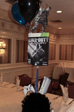 Video Game Themed Bar Mitzvah Centerpiece with Game Cover Photos