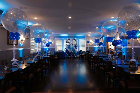 Blue LED Uplighting with Sparkle Balloon Centerpieces & Balloon Columns with Numbers for 50th Birthday at El Toro, Congers
