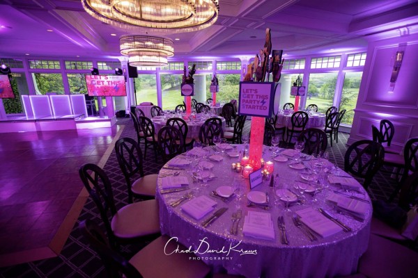 Purple  LED Uplighting With Themed Centerpieces for Bat Mitzvah Party at Scarsdale Golf Club