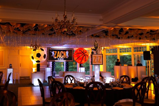 Yellow LED Uplighting, Sports Balloon Sculpture and Loose Ceiling Balloons for Bar Mitzvah at Scarsdale Golf Club, NY